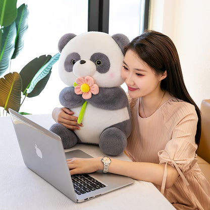 "Blumen haltende Panda-Plüschpuppe"