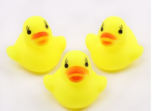Children Playing With Water Toys Small Yellow Duck