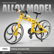 Gelbes faltbares Mountainbike Modell als detailreiches Dekoobjekt und Sammlerstück